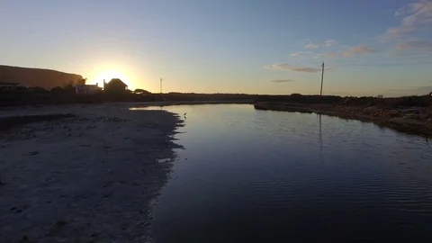 Perfectly Flat Lagoon at Sunset Stock Footage 79747561