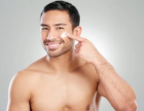 For perfectly flawless and pore-less skin. Studio shot of a handsome young man Stock Photos