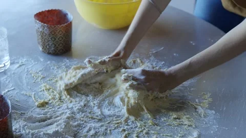 Perfectly Kneaded: Hands Working Dough Like an Artisan Stock Footage 300062943