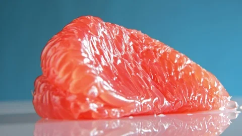 Perfectly Peeled Grapefruit slice rotating close up isolated Stock-Footage 122256764