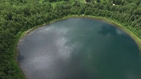 Perfectly round lake in the forest,landscape view, aerial view,drone shot  Stock-Footage 112222900