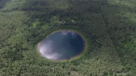 Perfectly round lake in the forest,landscape view, aerial view,drone shot  動画素材 112222907