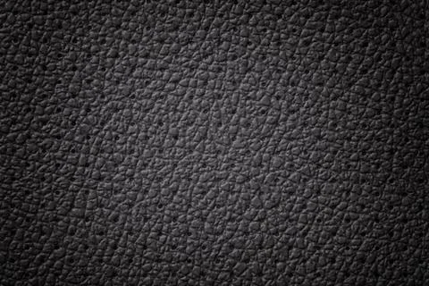Perforated black leather texture background. Gray backdrop from wrinkle skin. Stock Photos