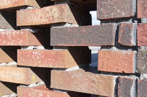 Perforated brick wall with mortar joints Stock Photos