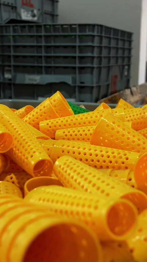 Perforated coloring tubes in a large basket. Textile factory. Yarn making Stock Footage 315756223