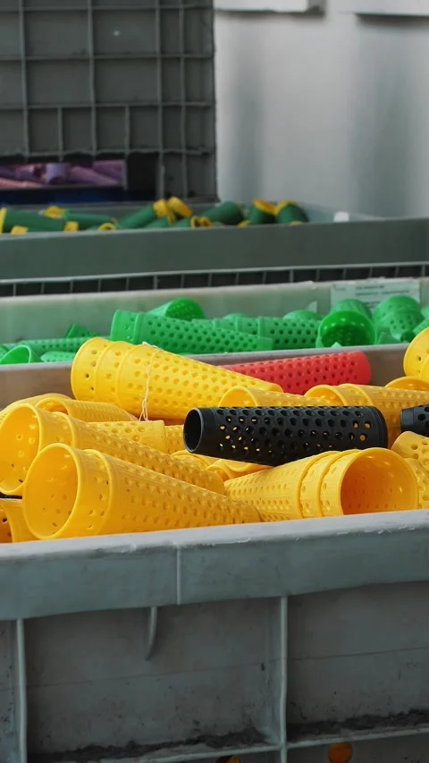 Perforated coloring tubes in a large basket. Textile factory equipment. Threads Stock Footage 318077682