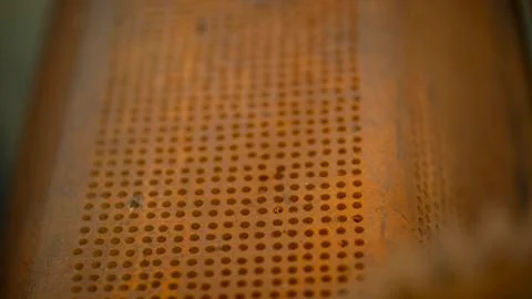 Perforated iron object. Stock Photos