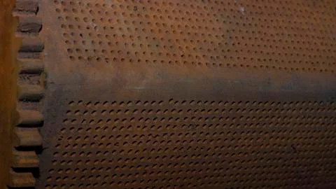 Perforated iron object. Stock Photos