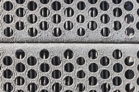 Perforated metal background. Grunge background of old iron with holes. Stock Photos