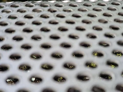 Perforated Metal Surface with Abstract Pattern Stock Photos