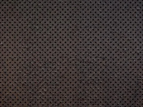 Perforated metal texture background Stock Photos