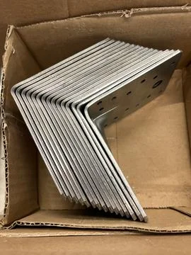 Perforated plate angles in the store Stock Photos