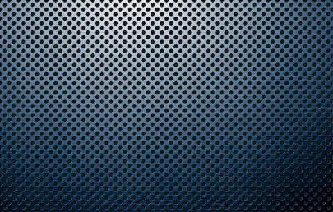 Perforated polished metal surface Stock Photos