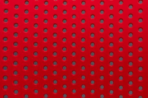 Perforated Red Metal Surface with Circular Hole Pattern for Modern Industri.. Stock Photos