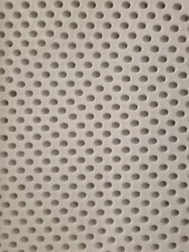 Perforated surface texture with circular holes abstract industrial background 스톡 사진