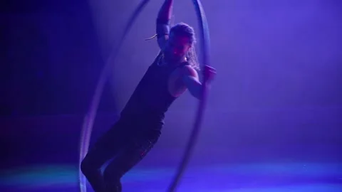 Performance of an acrobat with a ring on stage. Stock Footage 147407869