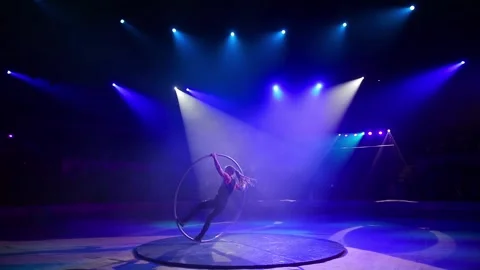 Performance of an acrobat with a ring on stage. Stock Footage 147407872