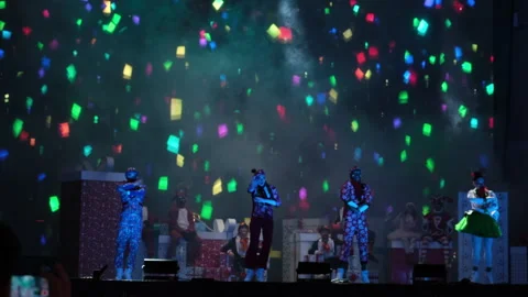 Performance of artists on festive stage with colored smoke on dark background. Stock Footage 252014095