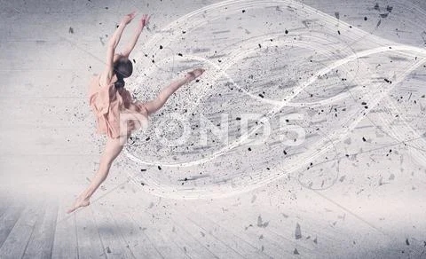 Performance ballet dancer jumping with energy explosion particles Stock Photos