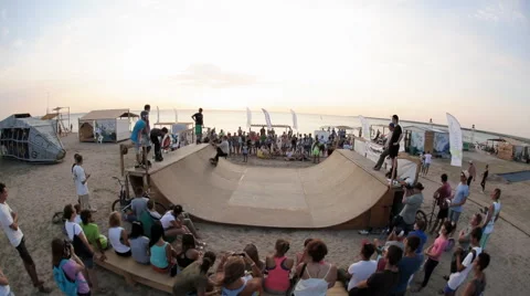 Performance of Boy on Roller Skates And Booty of spectators girls Stock Footage 59895374