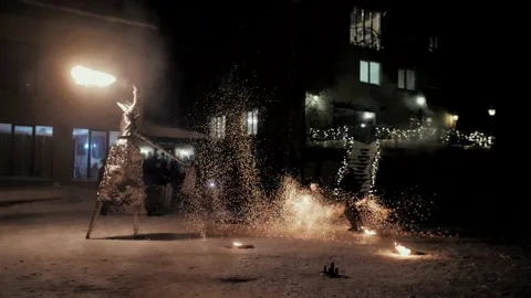 Performance of fire show artists. Artists wave and control the fire Stock Footage 231233788