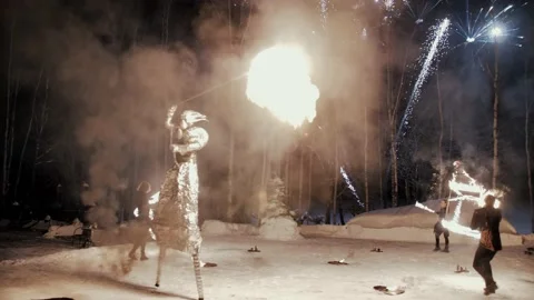 Performance of fire show artists.  Artists wave and control fire Stock Footage 231233806