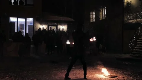 Performance of fire show artists.  Artists wave and control fire Stock Footage 231233848