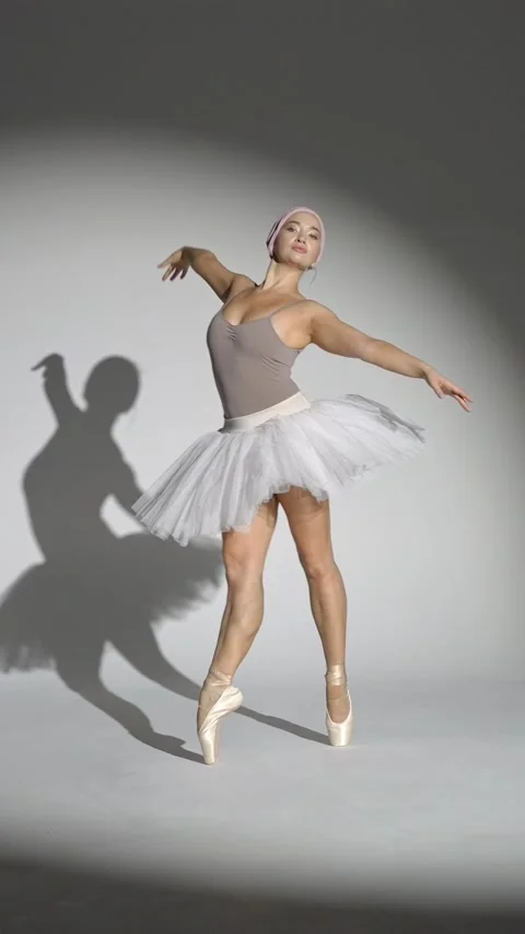 Performance, graceful ballerina in a white tutu dance and perform dramatic Stock Footage 290489228