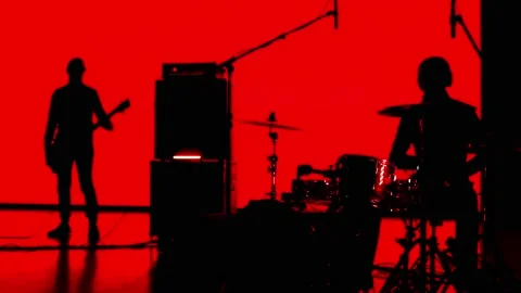 Performance of a rock group of musicians on stage, drummers singer and Видео 217359098