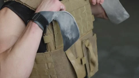 Performance of strength training with barbell while wearing a weighted vest Stock Footage 331019728