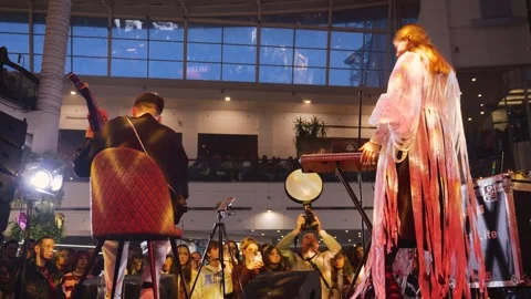 The performance is for Valentine's Day. There is a crowd of young fans. 스톡 동영상 329143765