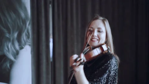 Performance of a violinist at an event, playing the violin Stock Footage 203593503