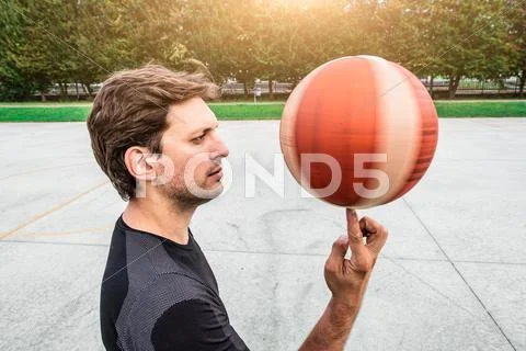 Performance of a white basketball player in the field of road Stock Photos