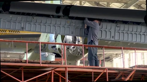 Performance of work on bulletins on An-12BK aircraft to extend service life. Video stock 221834223