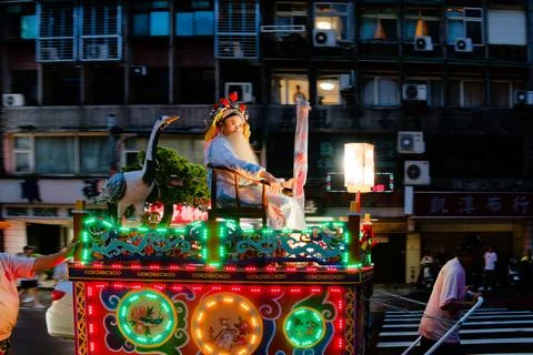 Performer Dressed as Deity on Float at Taiepi Xiahai City God Parade 스톡 사진