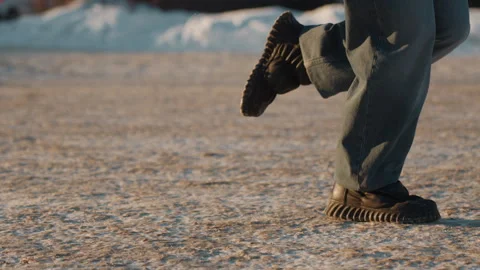 Performer executes smooth pivots over icy surface. Vibrant dance movements Stock Footage 335545130