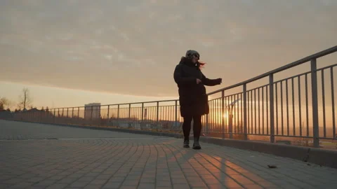 Performer executing steps during dawn outdoors. Full body dancer showcasing Stock Footage 338006086