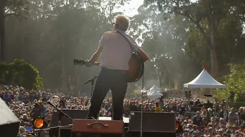PERFORMER IN FRONT OF CROWD Stock Footage 12284130