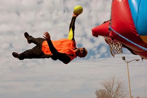 Performer Gets Sideways In Midair Attempting To Dunk Ball Stock Photos
