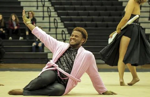 Performer posing on floor Foto stock