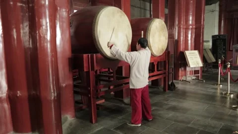 Performer Striking Drums at Drum and Bell Tower Beijing Interior Daytime Scene Stock Footage 341711853