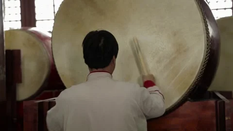 Performer Striking Large Drum Indoors at Drum and Bell Tower Beijing China Stock Footage 341712458