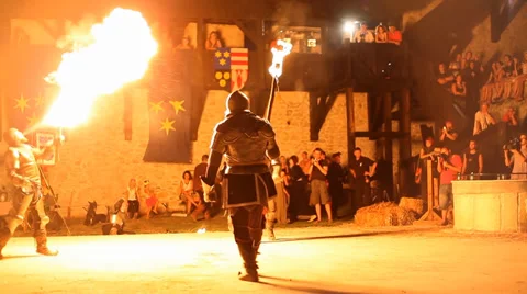 Performers hold lit torches and start to battle each other Stock Footage 36369697