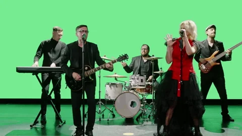Performers performing in studio against chromakey background Stock Footage 248641091