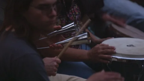 Performers playing drums and percussion instruments during a street performance Stock Footage 103432206