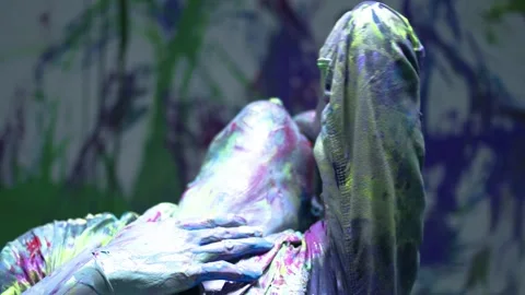 Performing art of a dancing man bathed in colored paint. expressionist Stock Footage 255374933