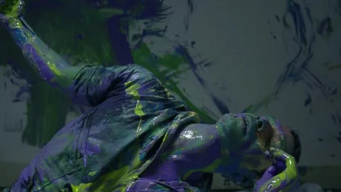 Performing art of a dancing man bathed in colored paint. freestyle Stock Footage 255599720