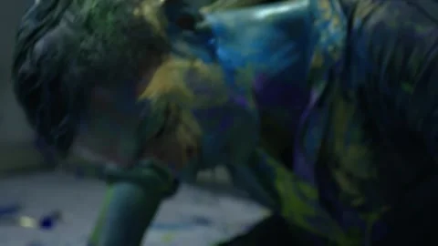 Performing art of a dancing man bathed in colored paint. expressive style Stock Footage 255599776