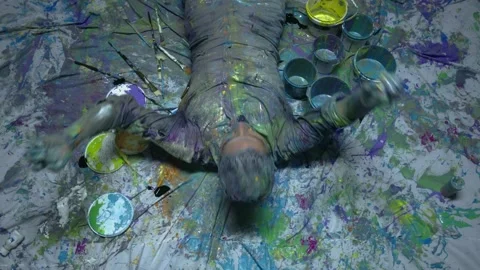 Performing artist dancing bathed in colored paint. expressionist painting. Stock Footage 255374931