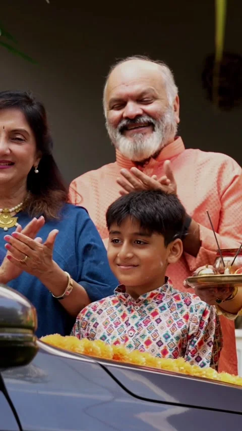 Performing car puja together, Indian family of six celebrating new vehicle Video stock 342839115